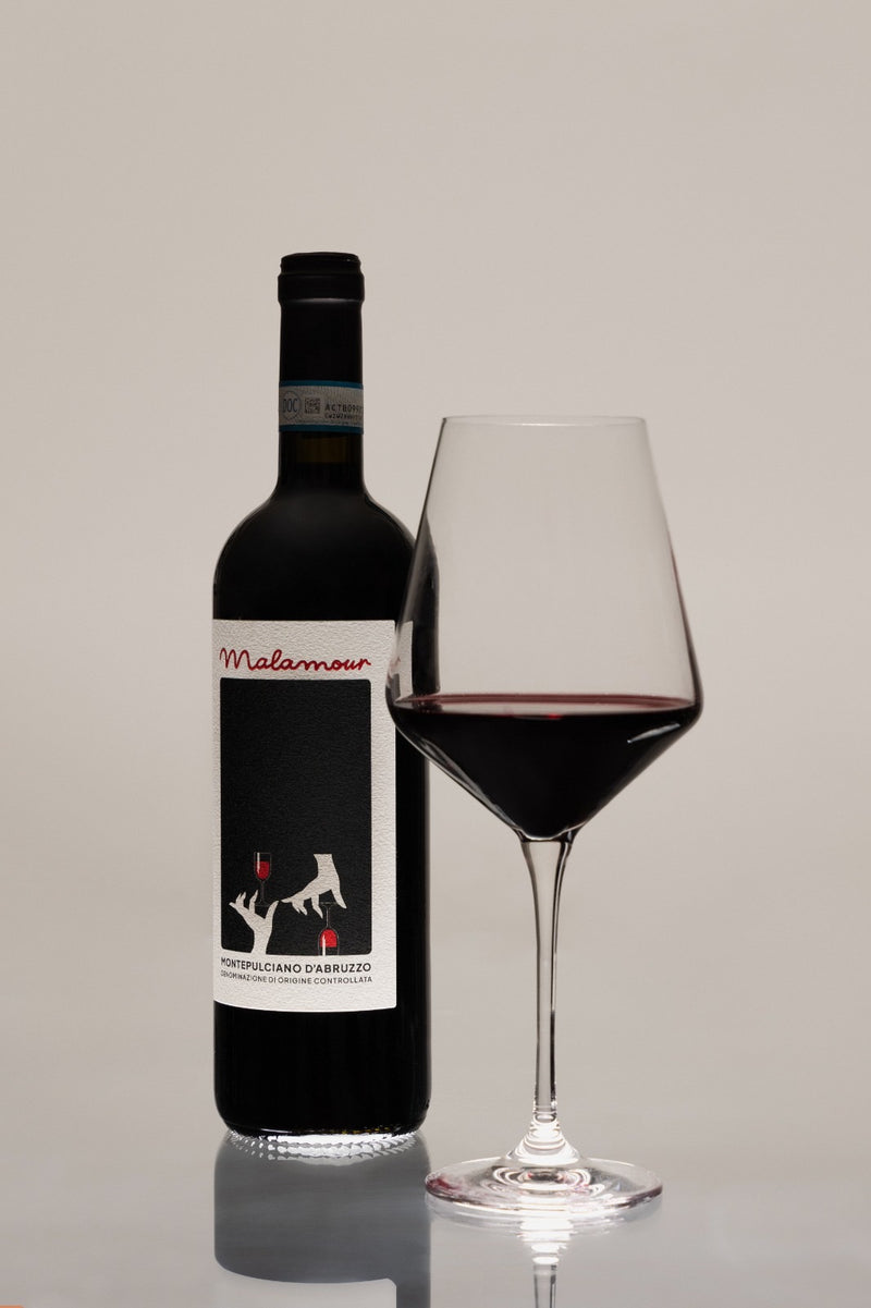 Malamour Red Montepulciano d'Abruzzo DOC bottle with poured glass of Italian red wine
